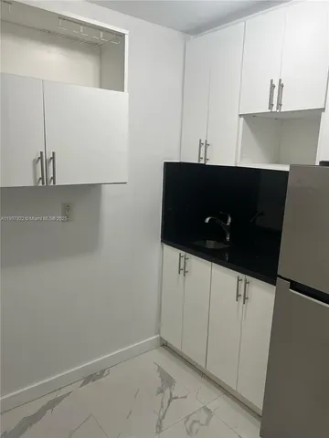 a view of cabinets and window