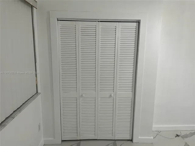 a kitchen with a sink and a refrigerator