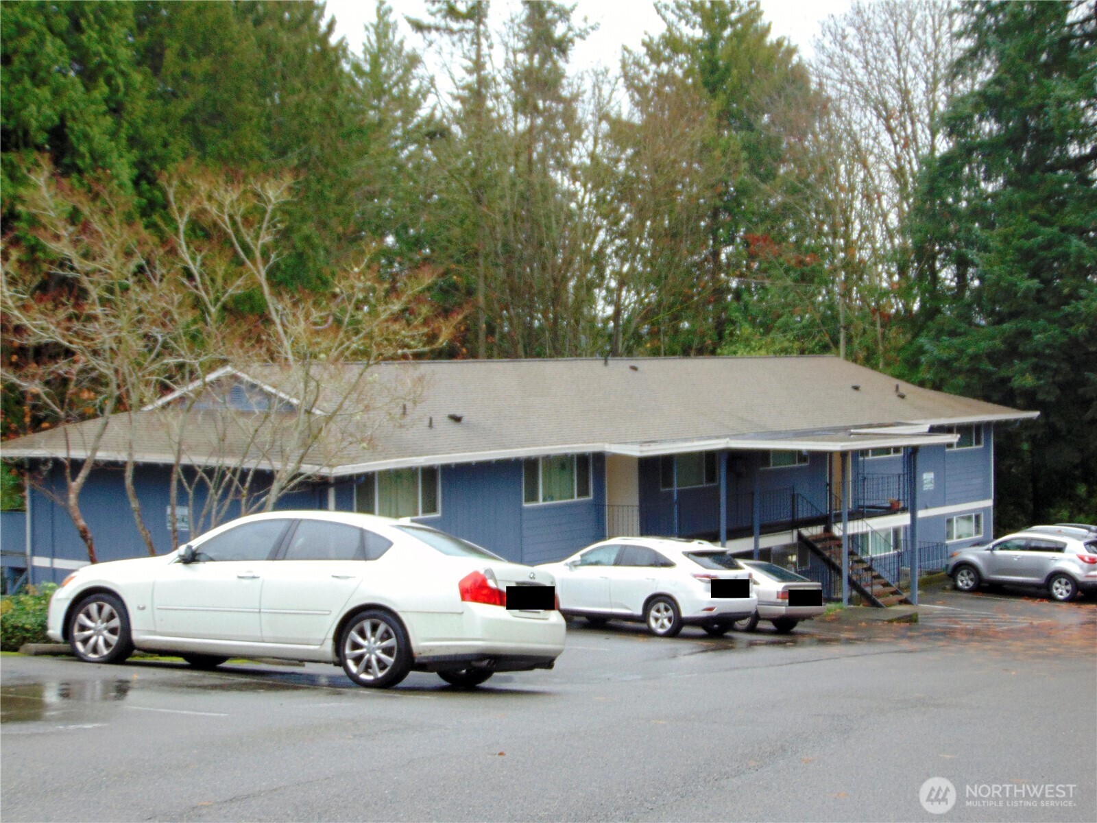 303 Poppy Road Bothell, WA 98012 - Photo 11 of 22 a car parked in front of a house