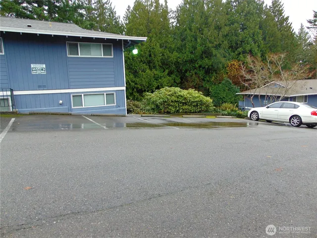 a view of a car park in front of house