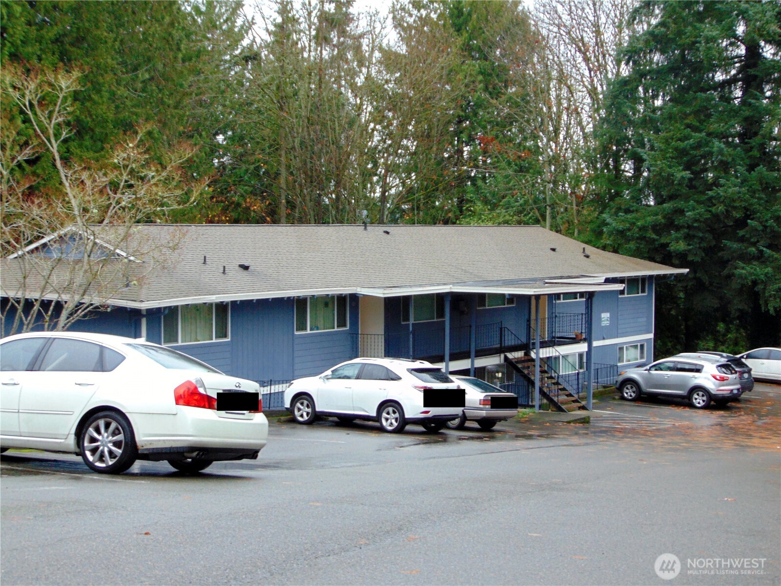 303 Poppy Road Bothell, WA 98012 - Photo 14 of 22 a car parked in front of a house