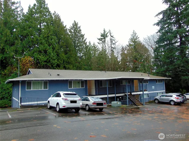 a front view of a house with parking space