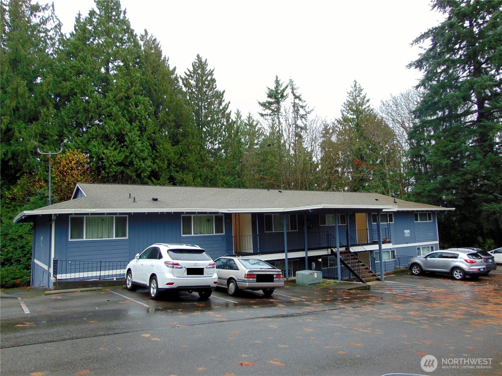 303 Poppy Road Bothell, WA 98012 - Photo 17 of 22 a car parked in front of a house
