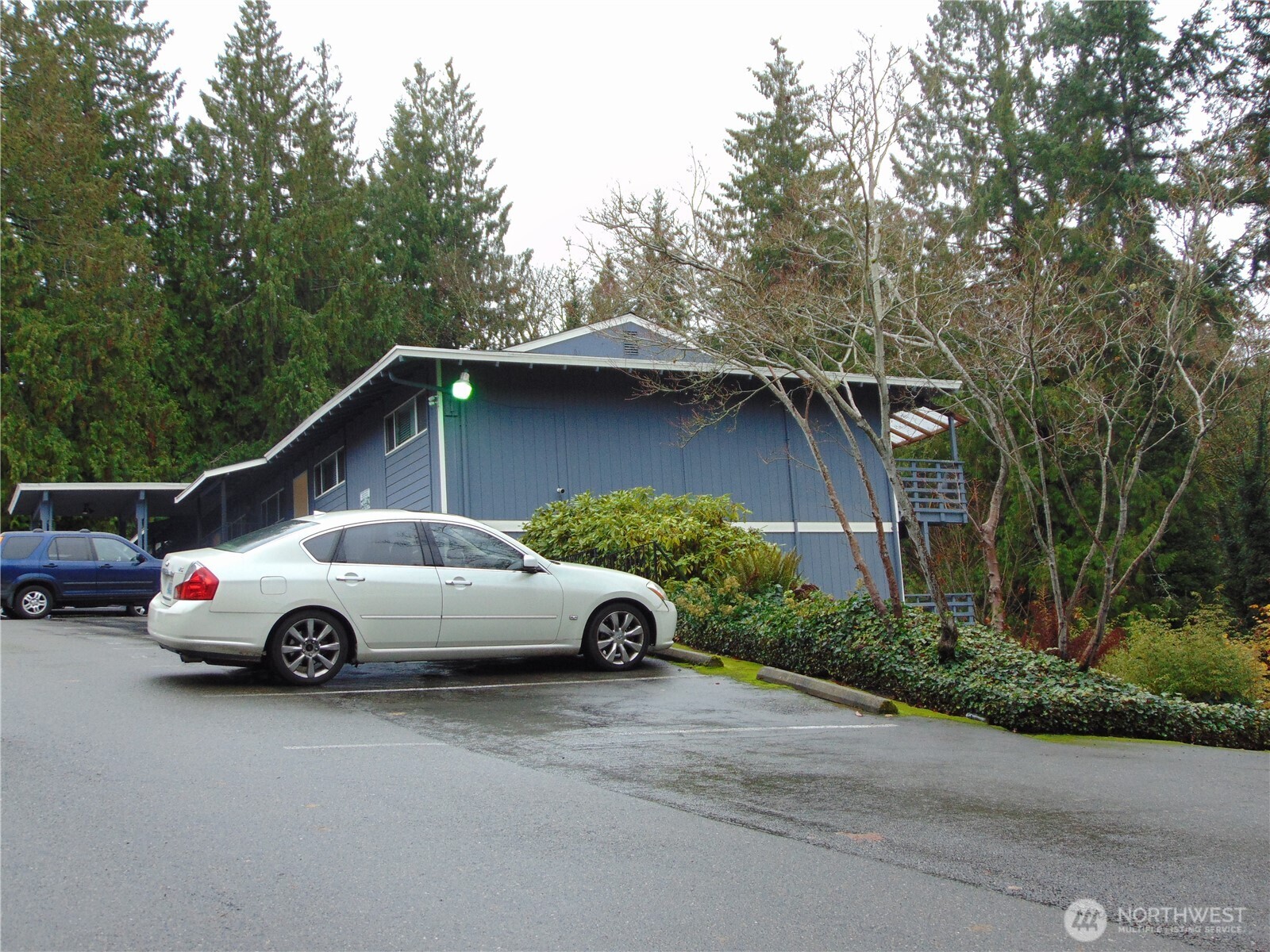 303 Poppy Road Bothell, WA 98012 - Photo 18 of 22 a front view of a house with parking space