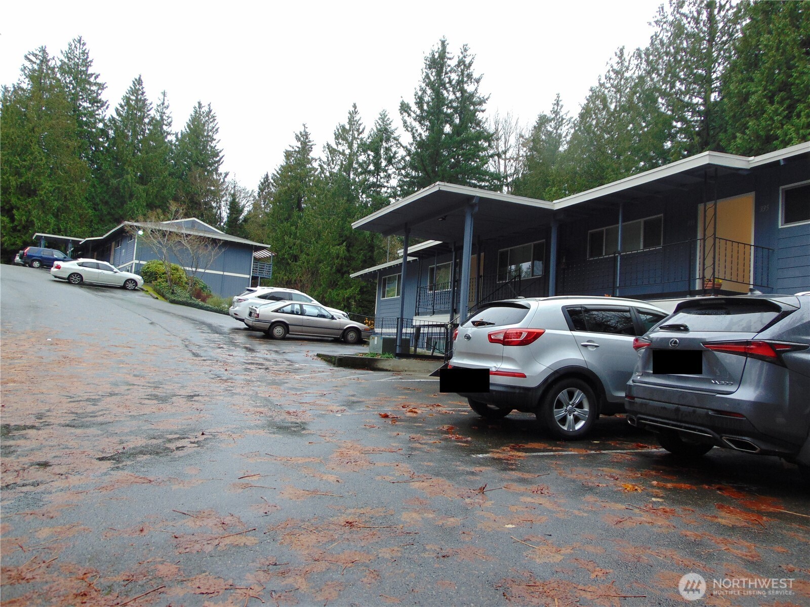 303 Poppy Road Bothell, WA 98012 - Photo 20 of 22 a car parked in front of a house