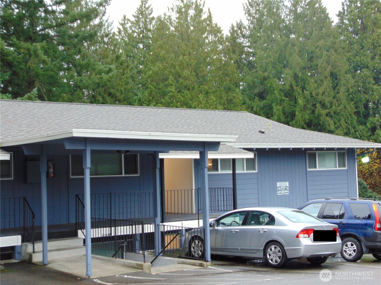 303 Poppy Road Bothell, WA 98012 - Photo 2 of 22 a car parked in front of a house