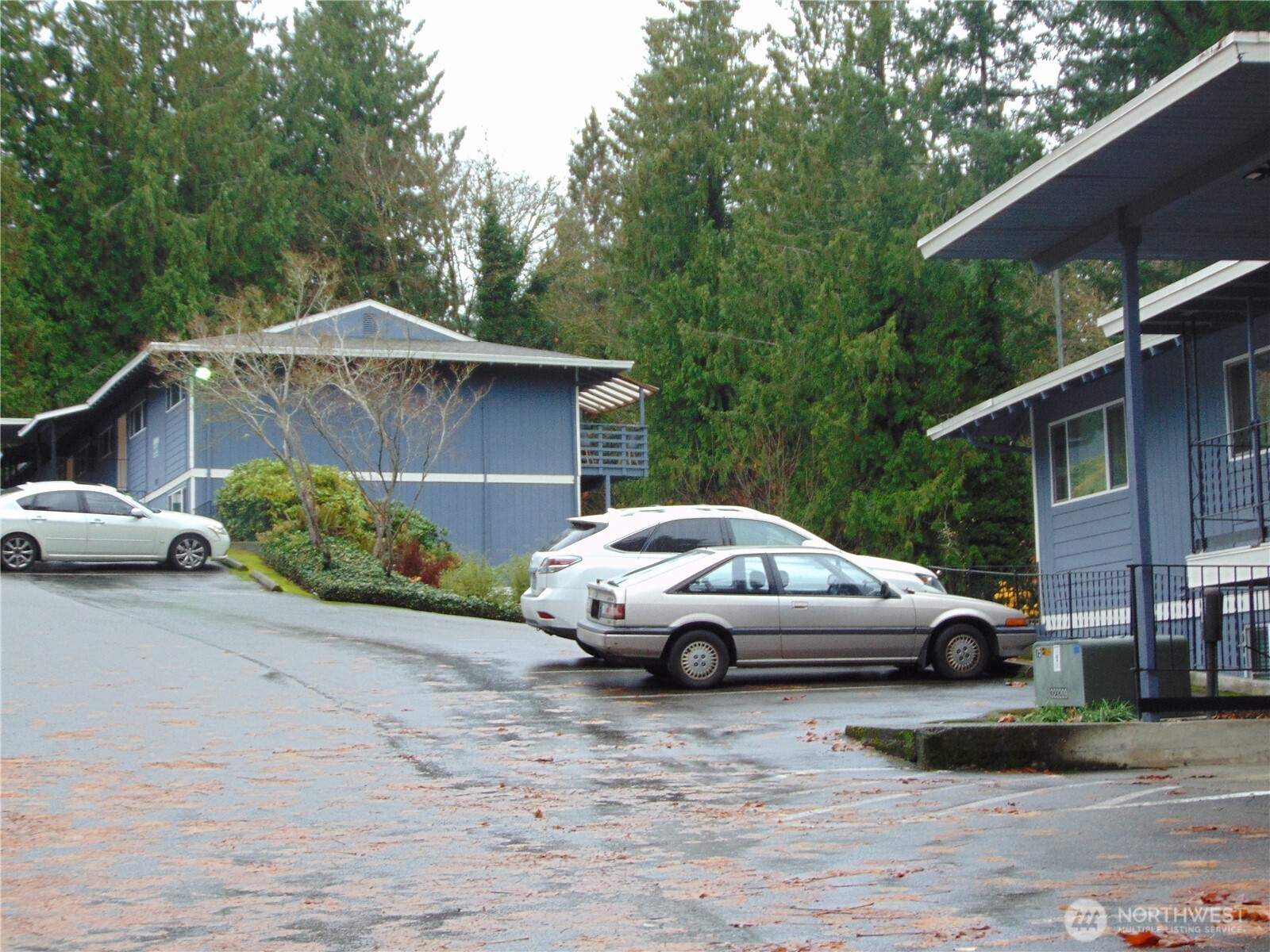 303 Poppy Road Bothell, WA 98012 - Photo 21 of 22 a white car parked in front of a house