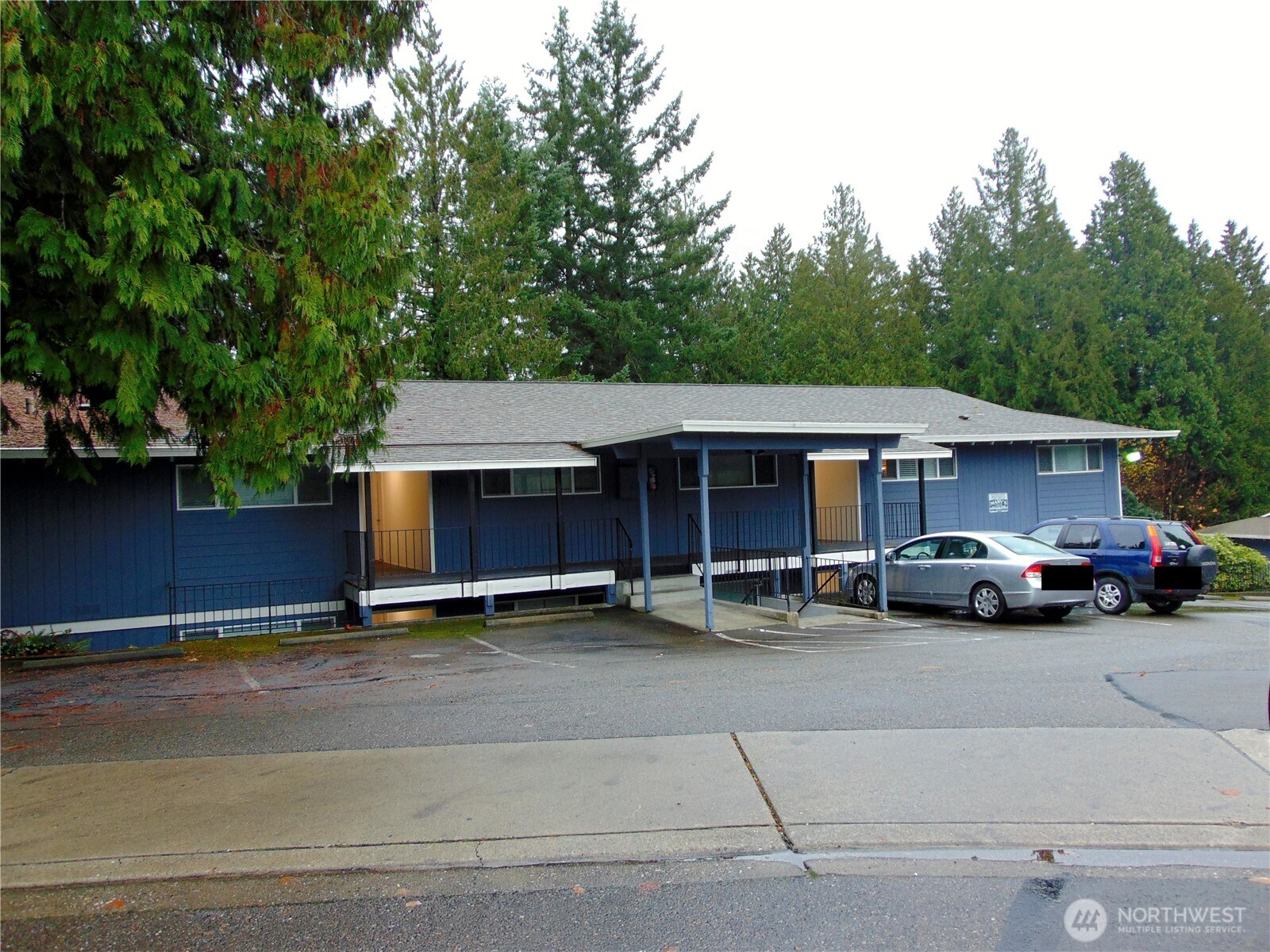 303 Poppy Road Bothell, WA 98012 - Photo 3 of 22 a view of street with parked cars