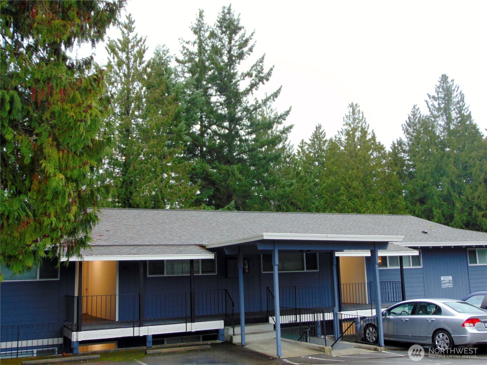 303 Poppy Road Bothell, WA 98012 - Photo 5 of 22 a car parked in front of a house