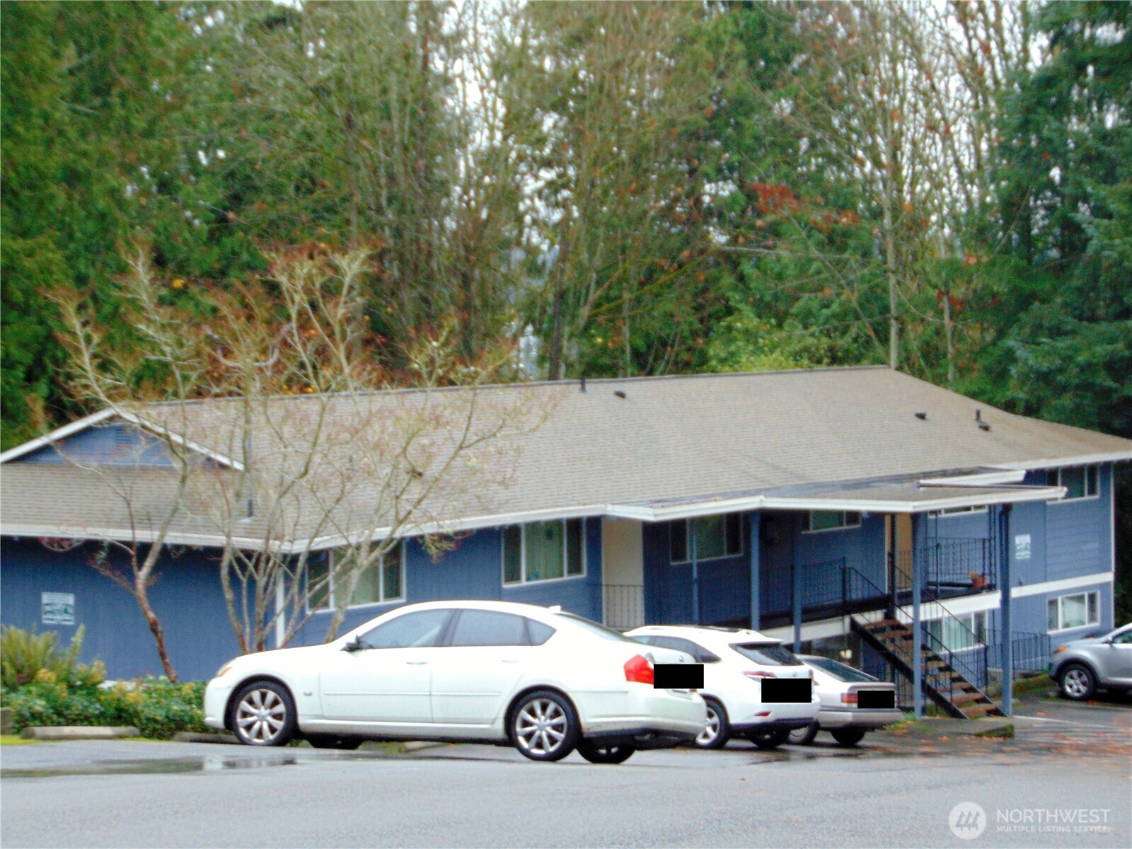 303 Poppy Road Bothell, WA 98012 - Photo 7 of 22 a car parked in front of a house