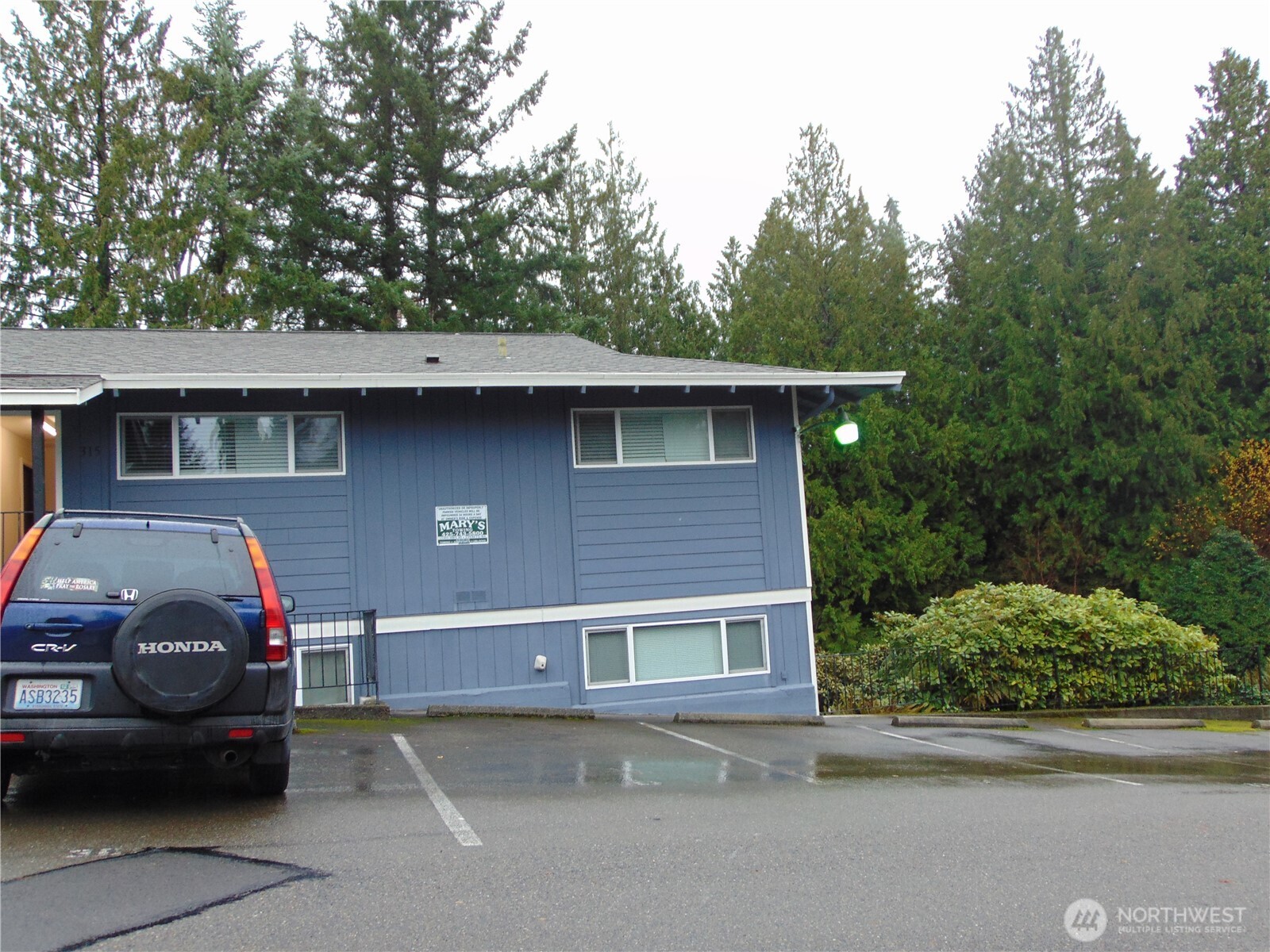 303 Poppy Road Bothell, WA 98012 - Photo 10 of 22 a front view of a house with a garden