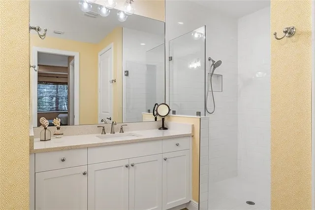 a bathroom with a double vanity sink mirror and double