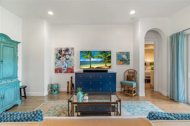 a living room with furniture and a flat screen tv