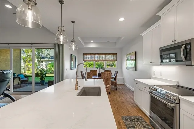 a living room with furniture a large window and a fireplace