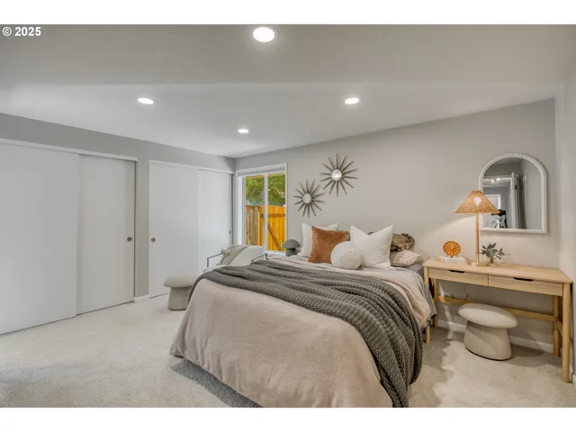 a bedroom with a bed and view of bathroom