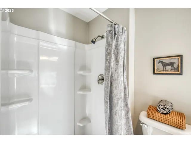 a bathroom with a shower and a sink