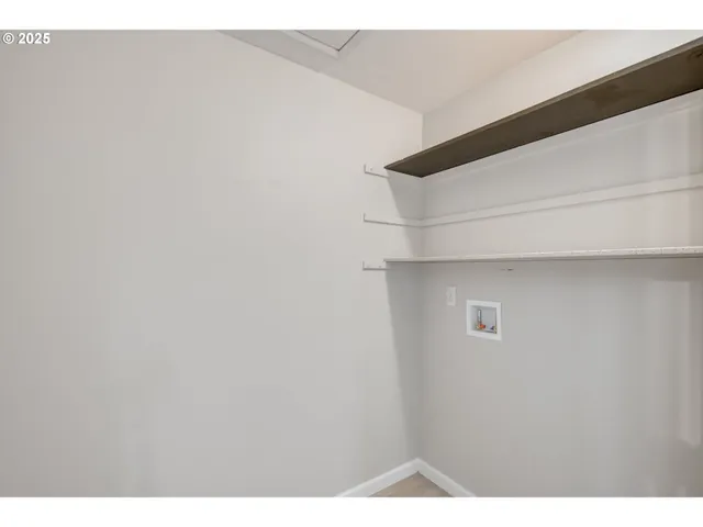 a view of a patio with table and chairs with wooden fence and plants