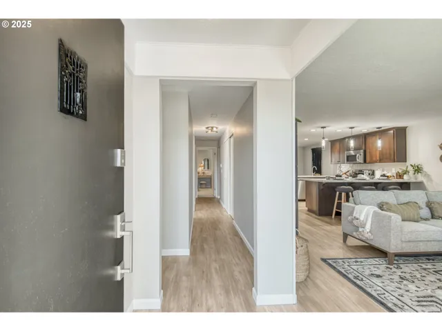 a view of a living room with furniture and a rug