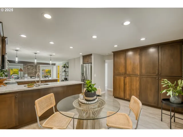 a lobby with furniture and a potted plant