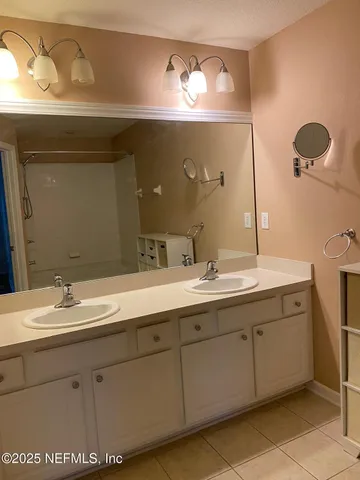 an aerial view of residential houses with outdoor space and river