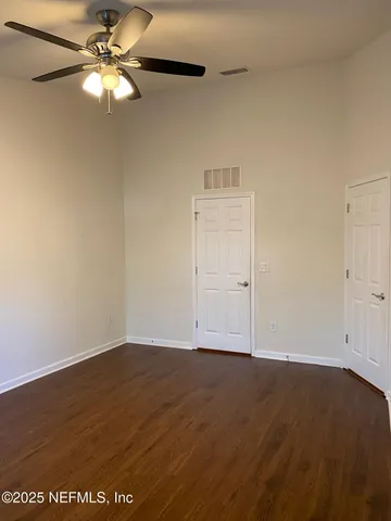 a view of a house with yard and sitting area