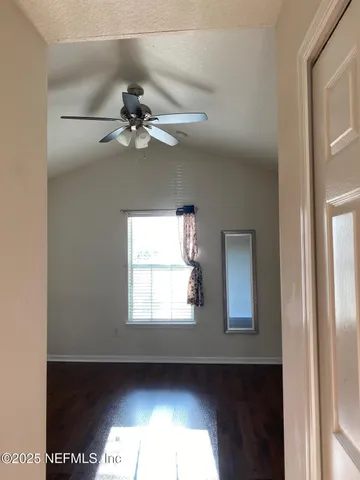 a view of an empty room and window