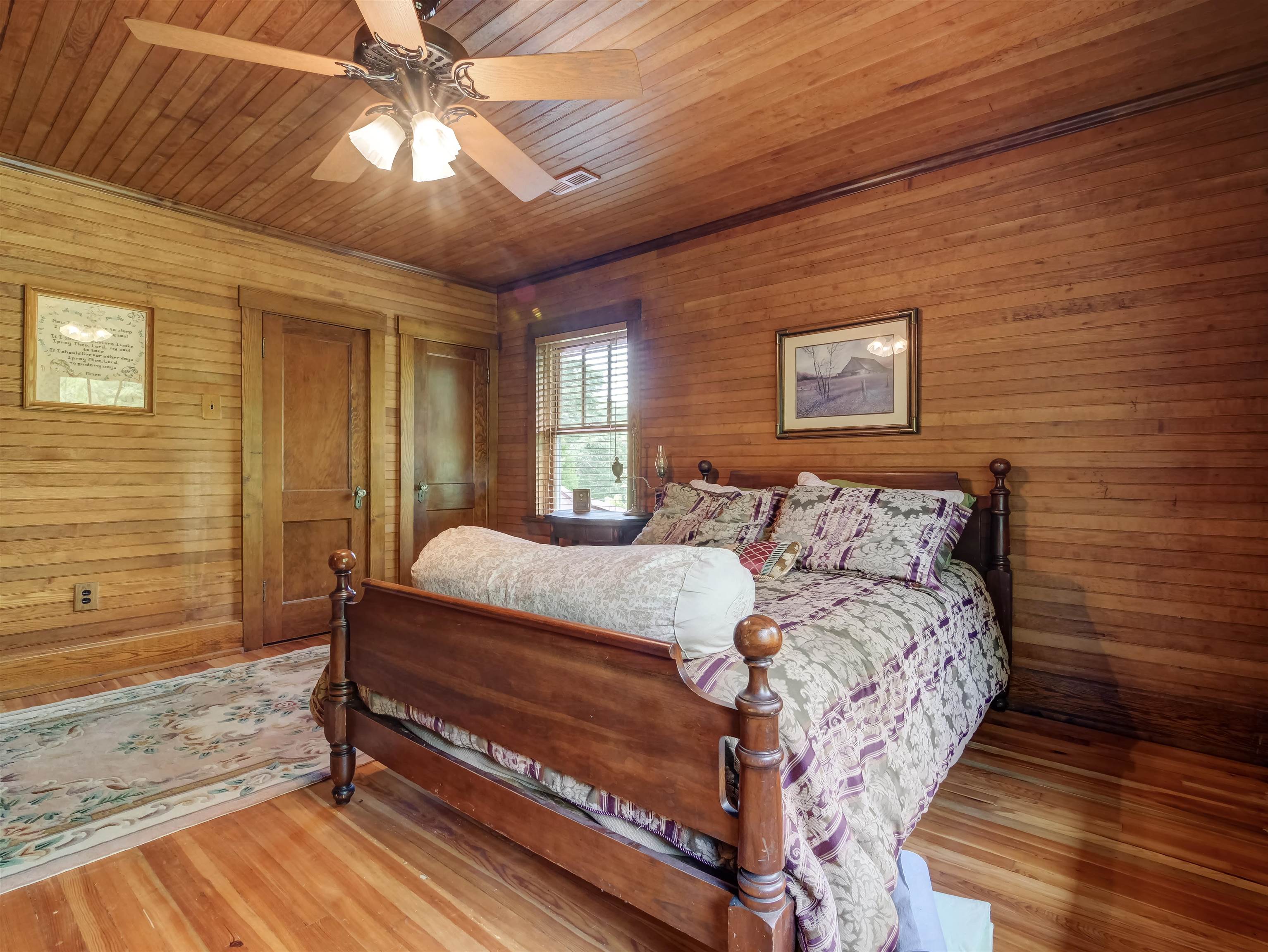 7304 Dry Run Road Williamsville, VA 24487 - Photo 35 of 57 a bedroom with a bed and a chandelier