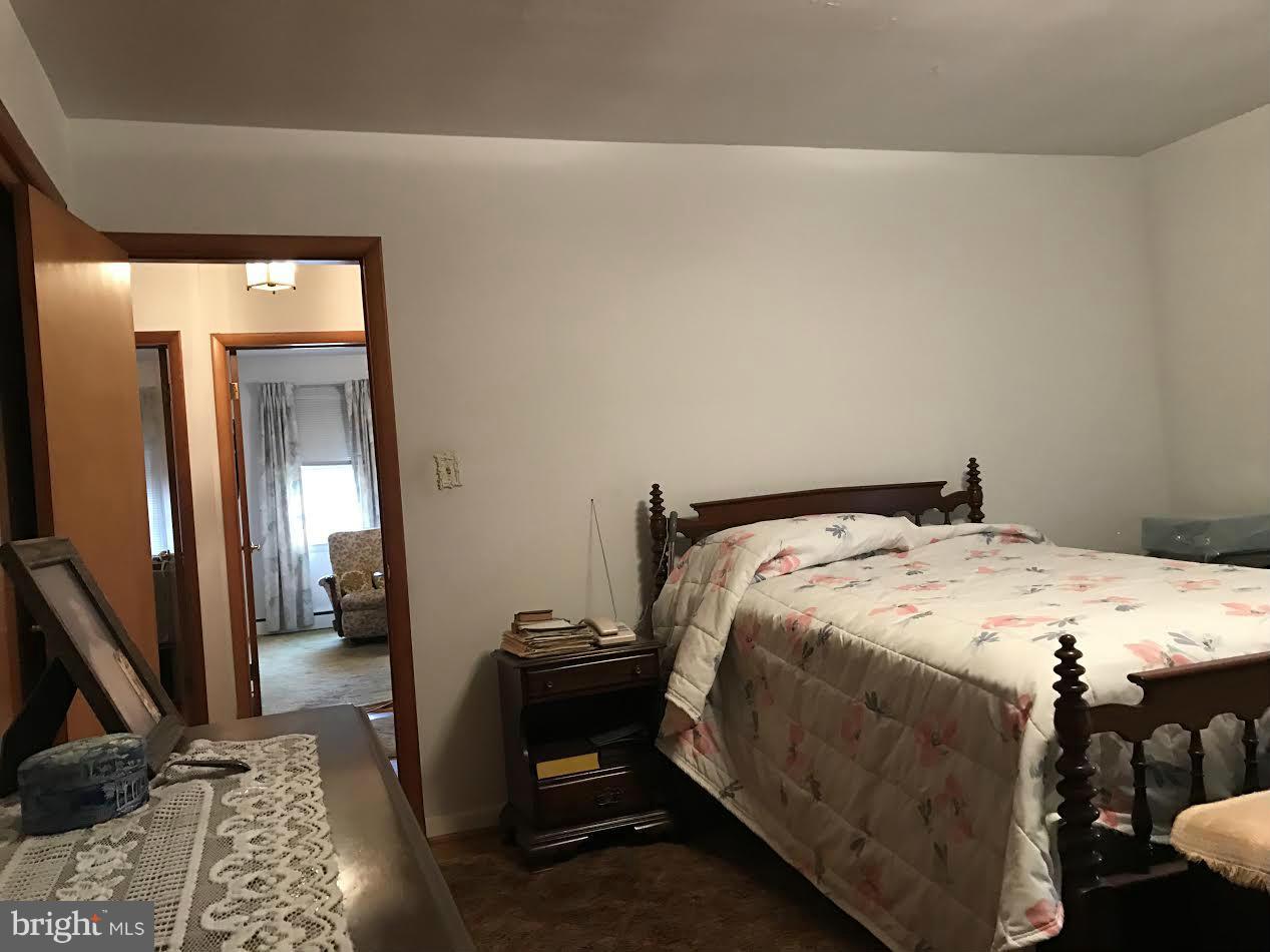 2622 Pleasantville Road Fallston, MD 21047 - Photo 7 of 29 a bedroom with a bed and mirror