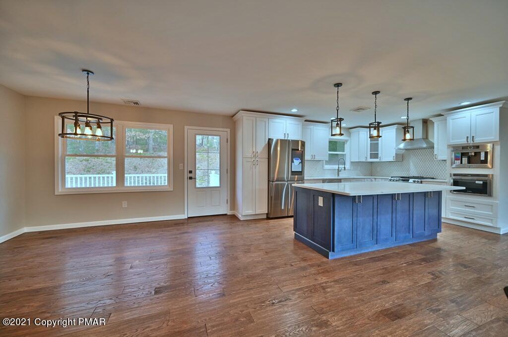 1140 Milford Road Dingmans Ferry, PA 18328 - Photo 12 of 44 Dining to kitchen
