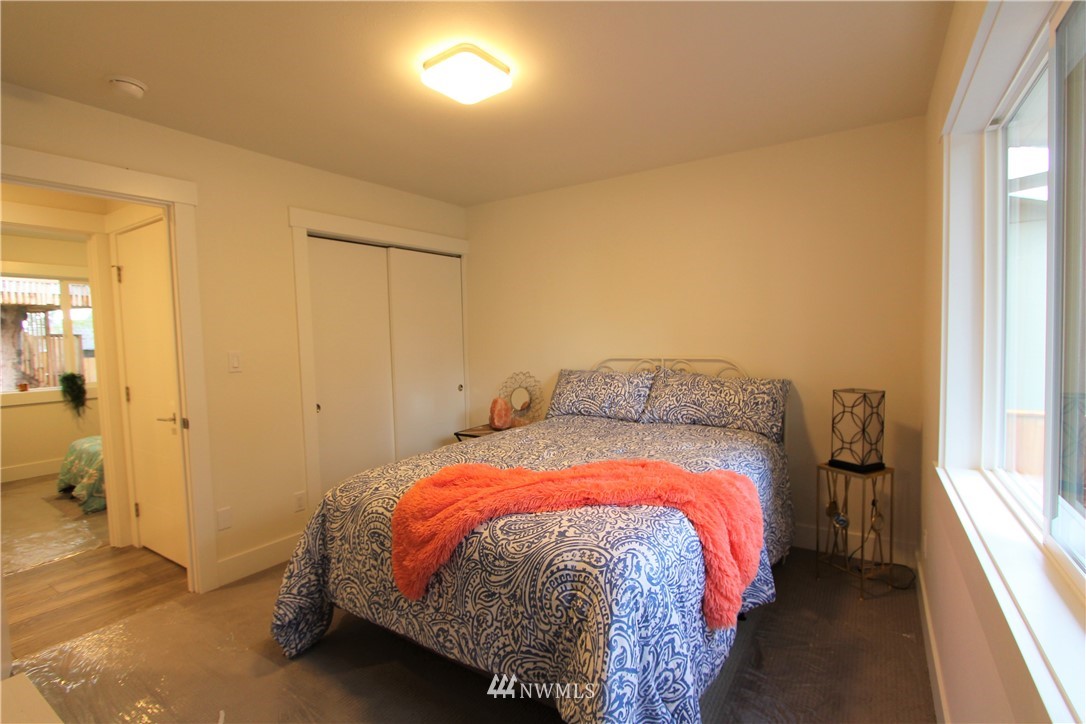 3309 Northeast 10th Street Renton, WA 98056 - Photo 22 of 30 a bed sitting in a bedroom next to a window