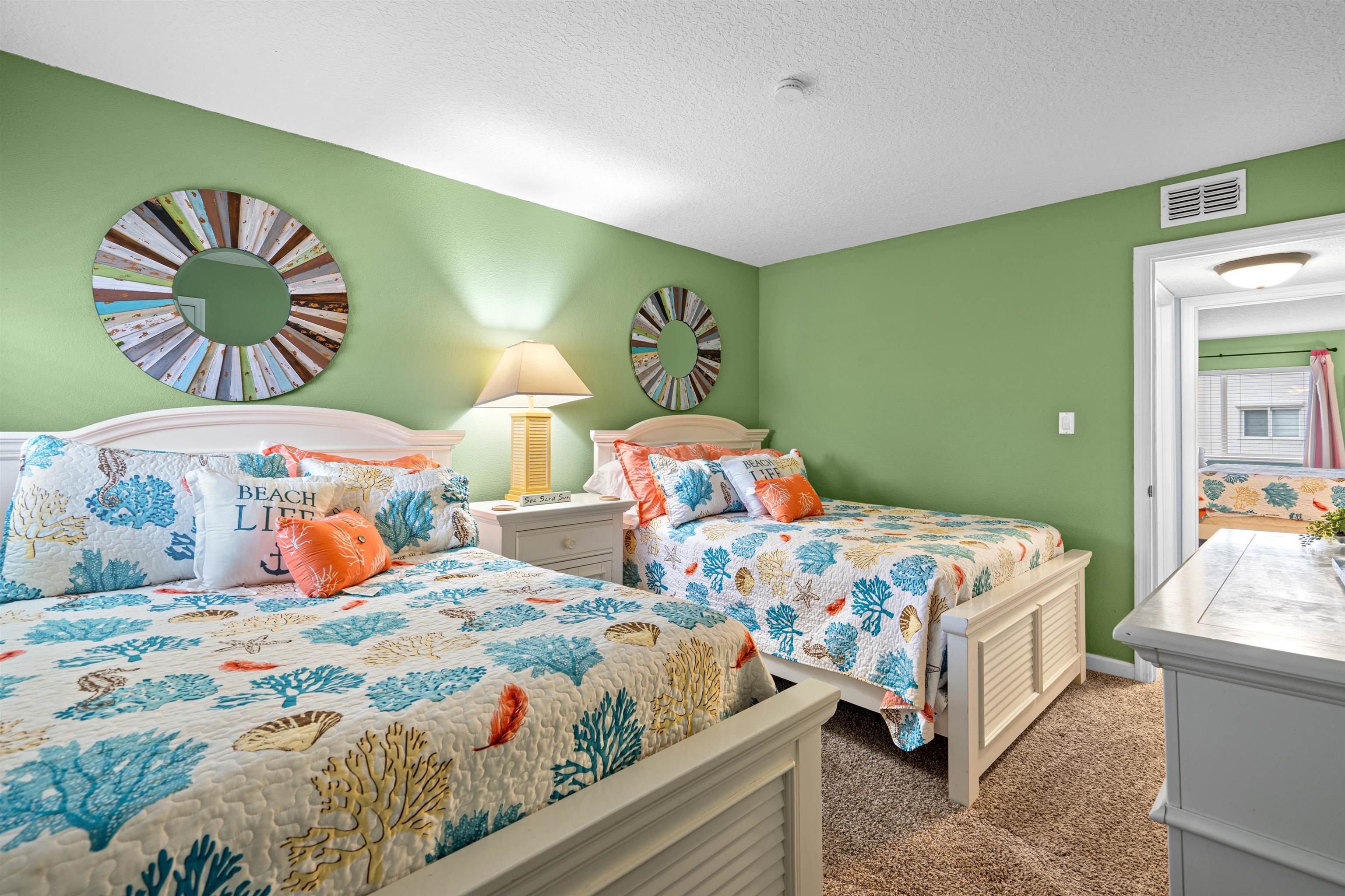 1 Ocean Trace Road, Unit 232 St. Augustine, FL 32080 - Photo 16 of 49 a bedroom with two beds and a painting on the wall