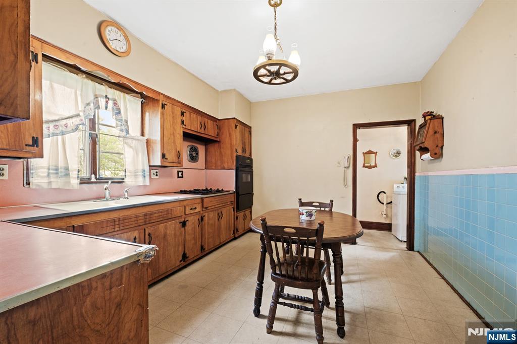 10 Beech Street Rutherford, NJ 07070 - Photo 16 of 41 a kitchen with stainless steel appliances granite countertop a sink and a refrigerator