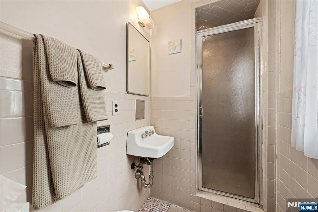 10 Beech Street Rutherford, NJ 07070 - Photo 20 of 41 a bathroom with a sink toilet and shower