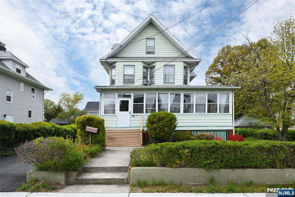 10 Beech Street Rutherford, NJ 07070 - Photo 2 of 41 a front view of a house with a yard