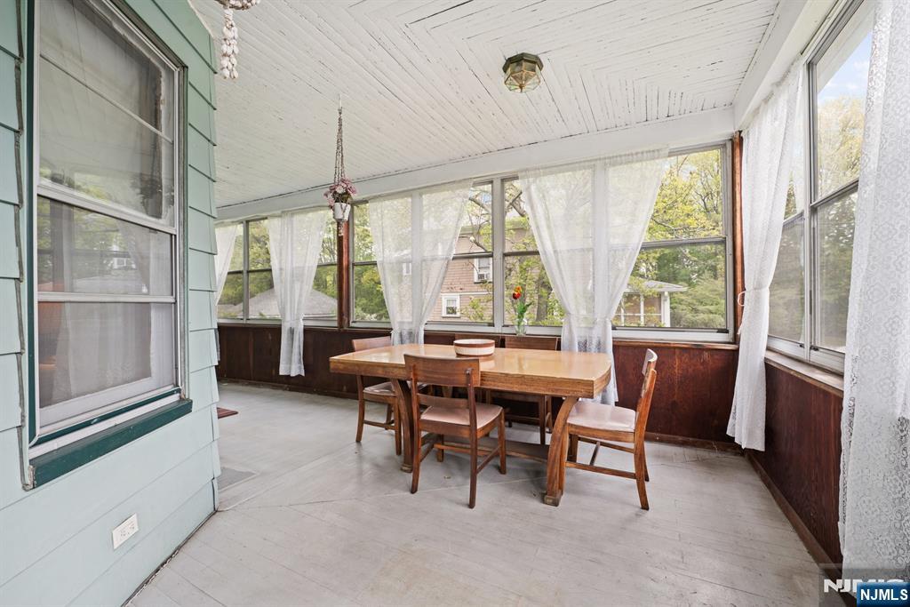 10 Beech Street Rutherford, NJ 07070 - Photo 23 of 41 a dining room with furniture and a floor to ceiling window