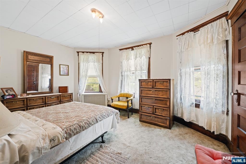 10 Beech Street Rutherford, NJ 07070 - Photo 28 of 41 a bedroom with a bed and a window