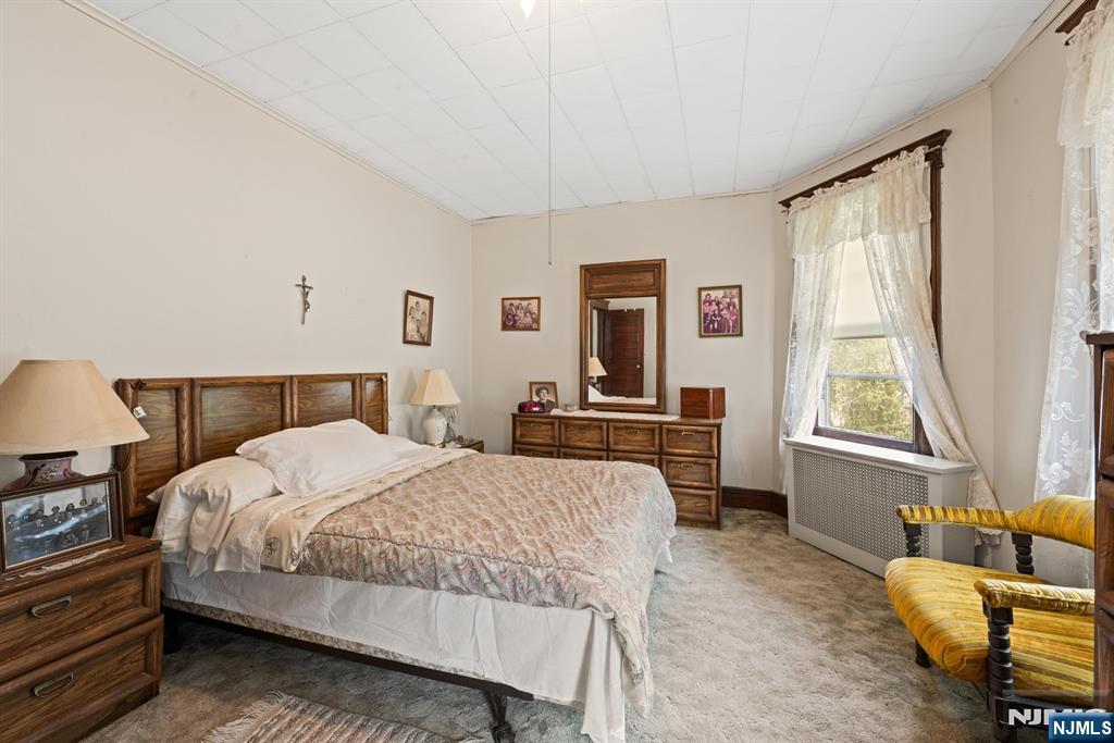 10 Beech Street Rutherford, NJ 07070 - Photo 29 of 41 a bedroom with a bed and a couch