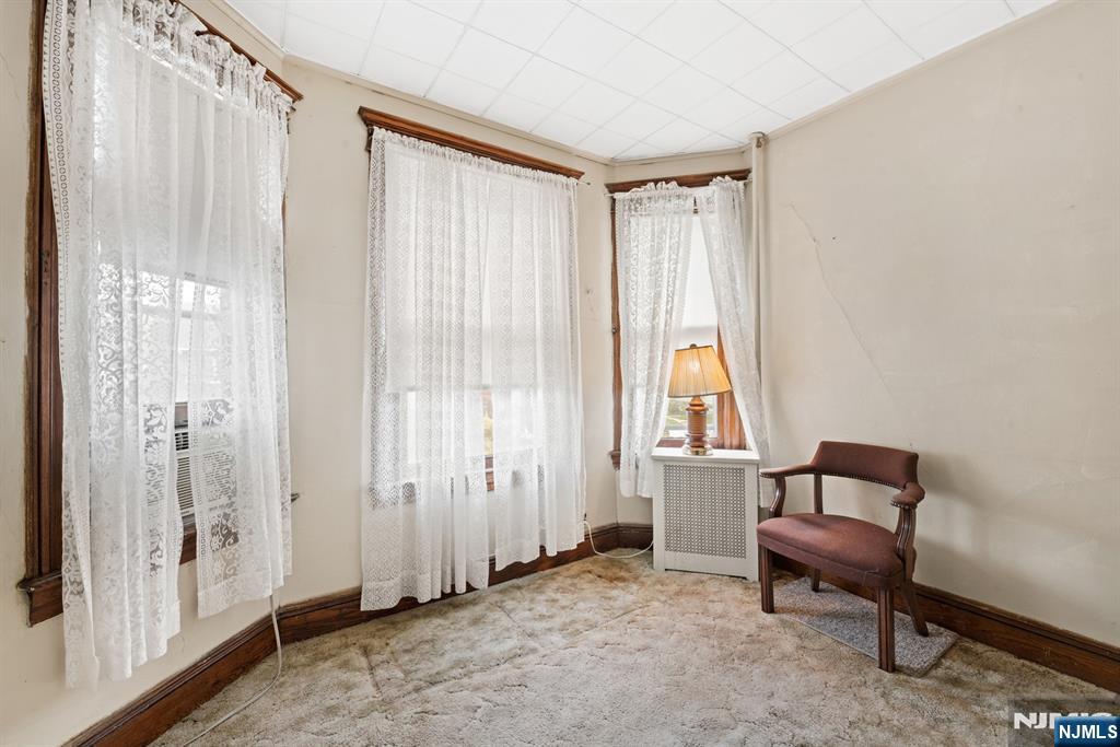 10 Beech Street Rutherford, NJ 07070 - Photo 34 of 41 a spacious bedroom with a bed and a window