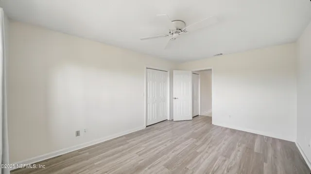 a view of a garden with a bench in the garden
