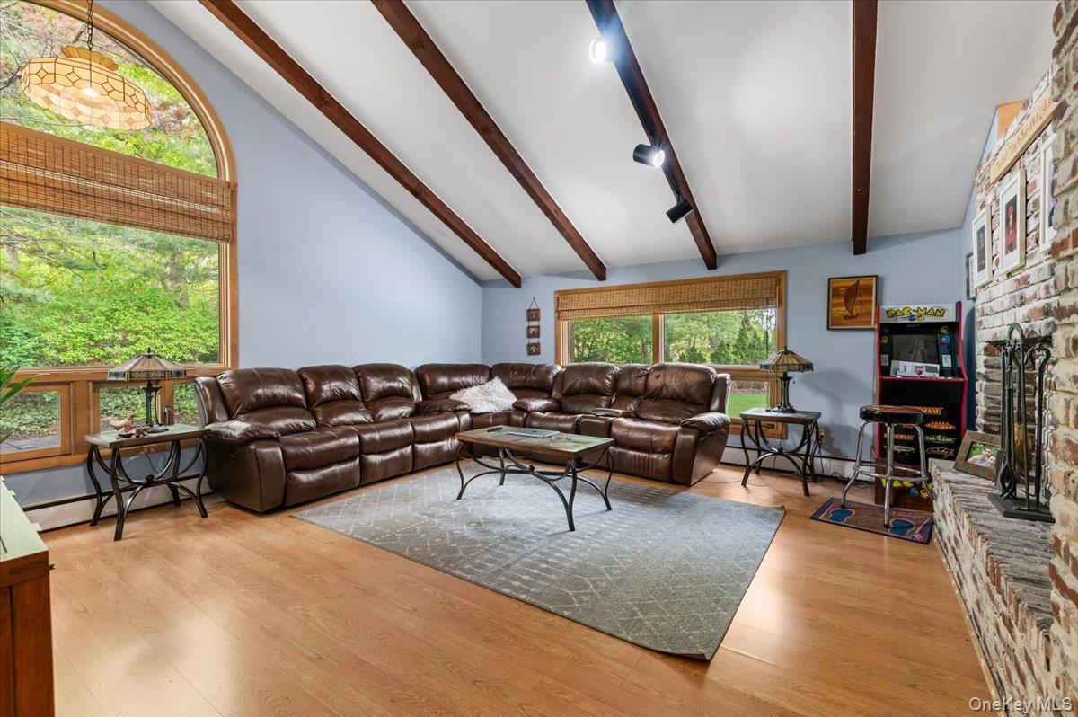 6 Apex Road Melville, NY 11747 - Photo 9 of 50 a living room with furniture and a large window