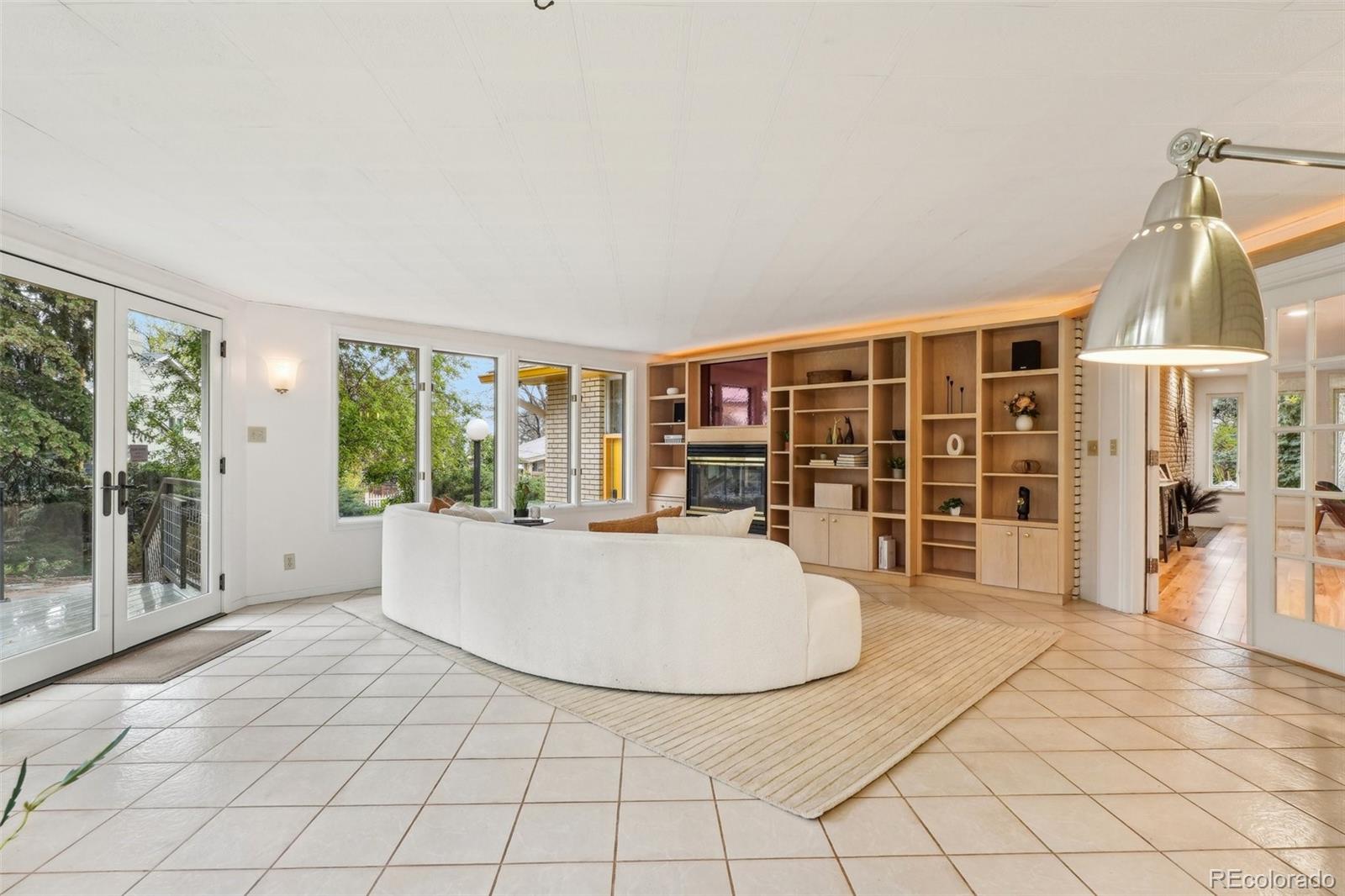 1118 Eagle Road Broomfield, CO 80020 - Photo 18 of 50 a view of empty room with wooden floor and large windows