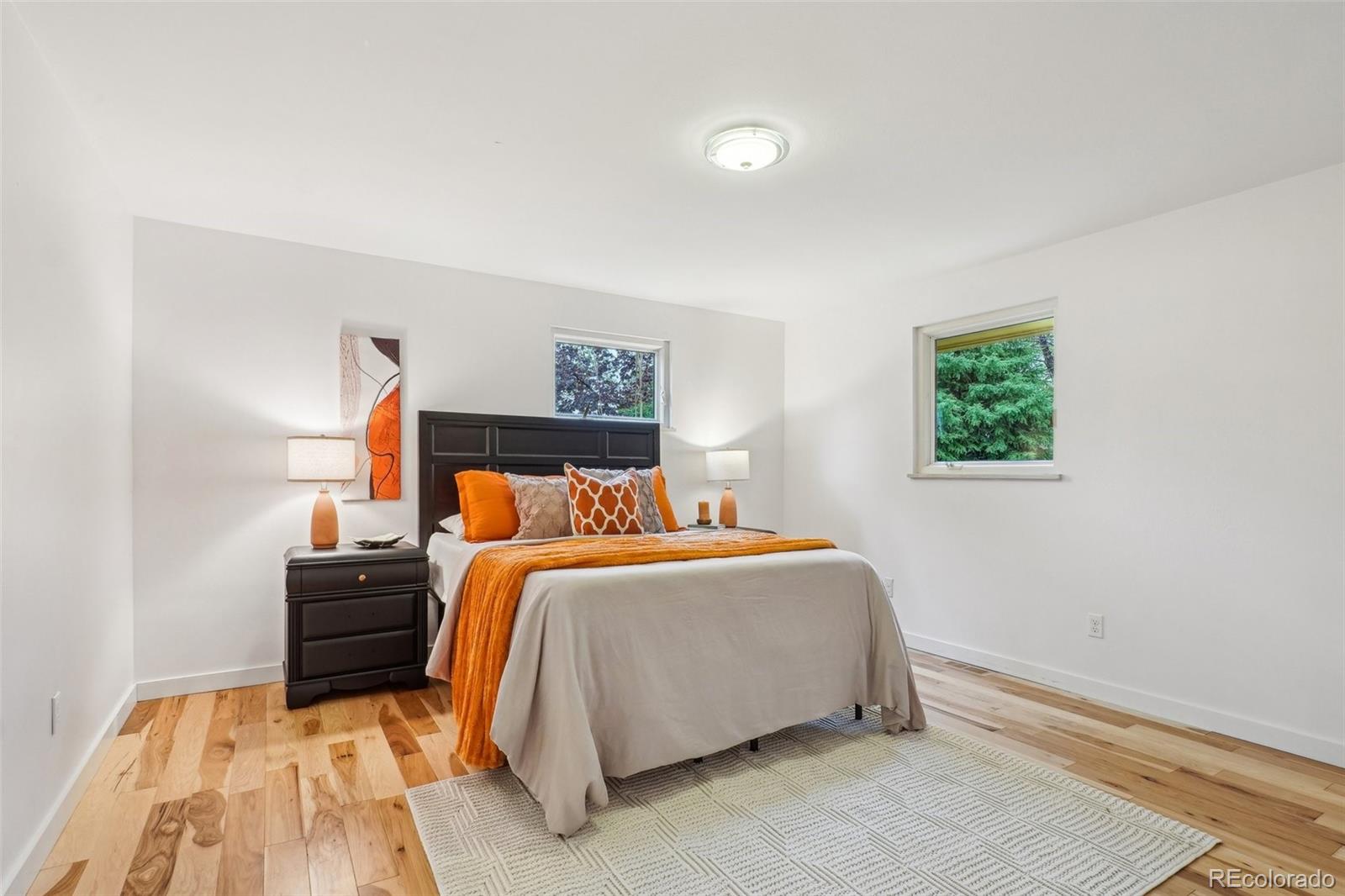 1118 Eagle Road Broomfield, CO 80020 - Photo 19 of 50 a bedroom with a bed and a night stand