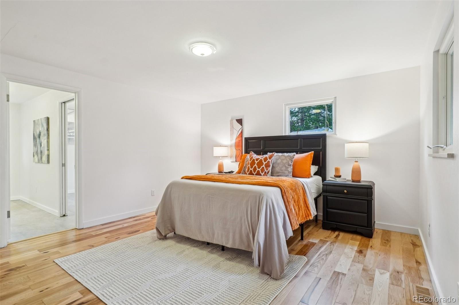 1118 Eagle Road Broomfield, CO 80020 - Photo 20 of 50 a bedroom with a bed and a night stand