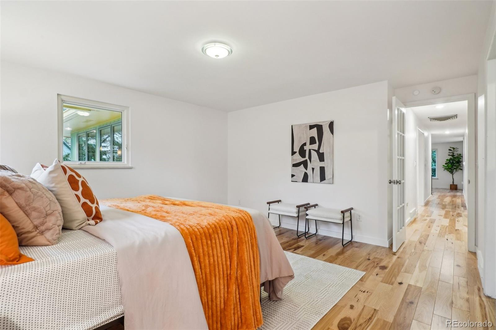 1118 Eagle Road Broomfield, CO 80020 - Photo 21 of 50 a bedroom with a bed and wooden floor