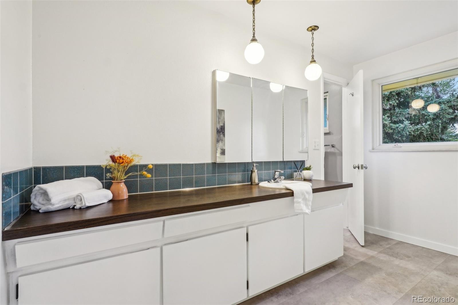 1118 Eagle Road Broomfield, CO 80020 - Photo 22 of 50 a kitchen with a sink and a white cabinets