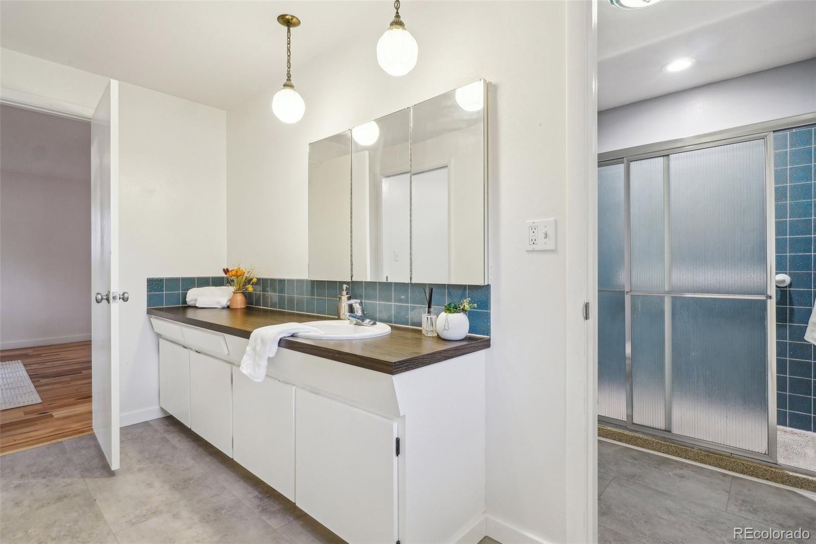 1118 Eagle Road Broomfield, CO 80020 - Photo 23 of 50 a bathroom with a sink and mirror