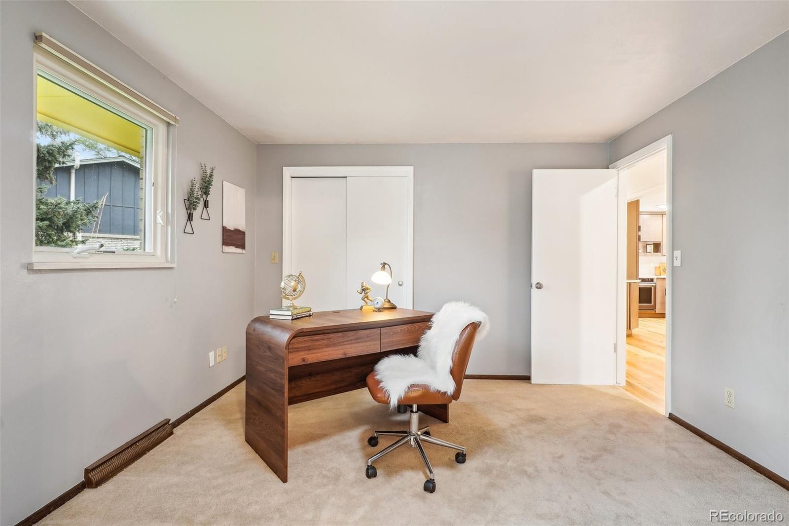 1118 Eagle Road Broomfield, CO 80020 - Photo 29 of 50 a view of a workspace with furniture and a window
