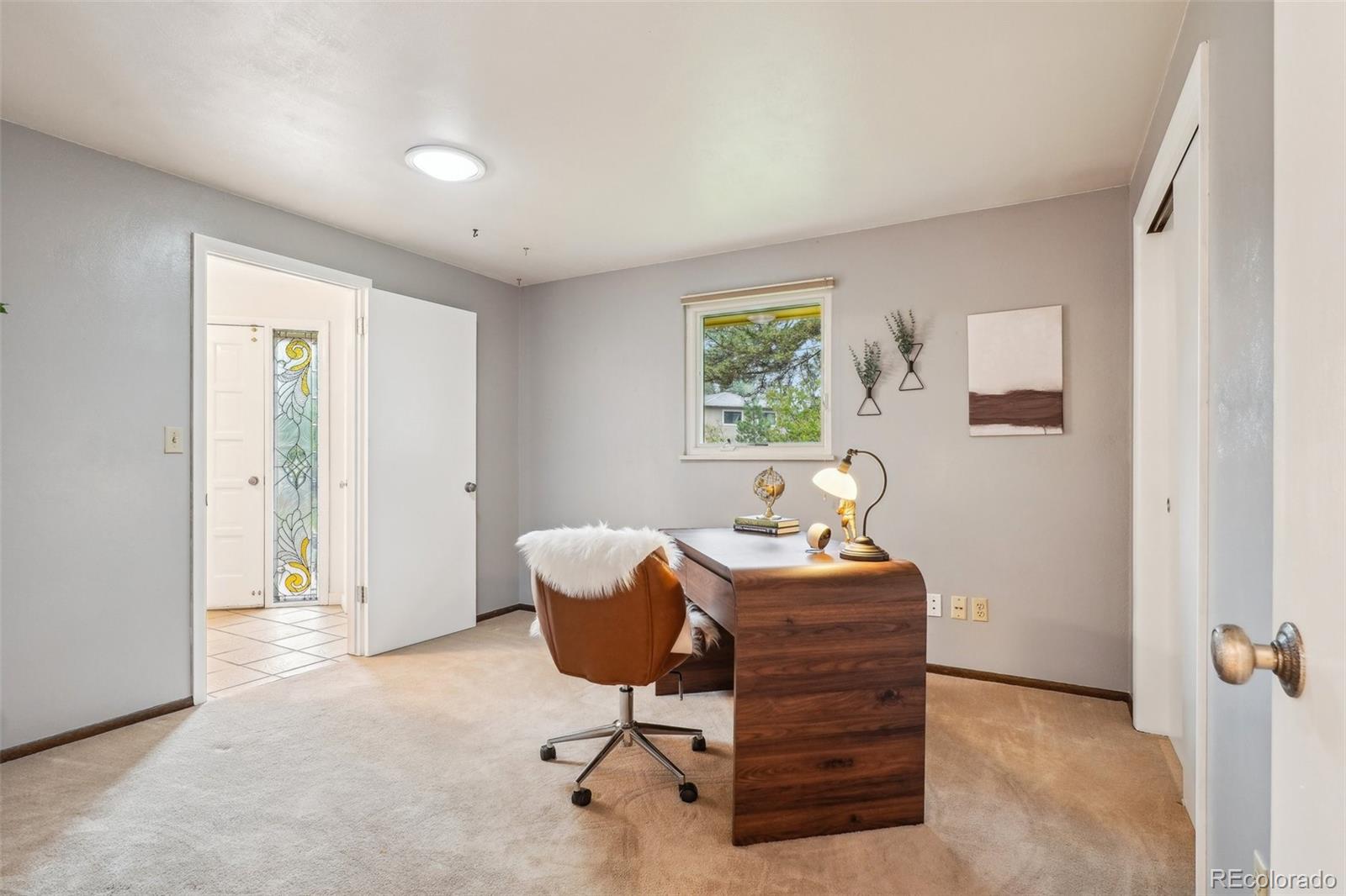 1118 Eagle Road Broomfield, CO 80020 - Photo 30 of 50 a workspace with furniture and a window