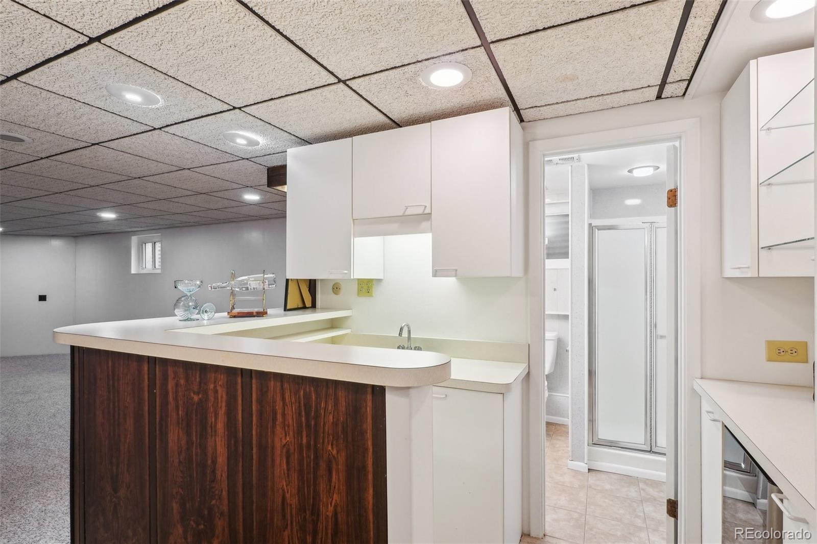 1118 Eagle Road Broomfield, CO 80020 - Photo 35 of 50 a bathroom with a sink vanity granite and a mirror