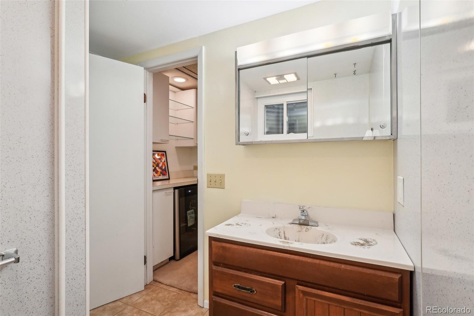 1118 Eagle Road Broomfield, CO 80020 - Photo 36 of 50 a bathroom with a sink a vanity and a mirror